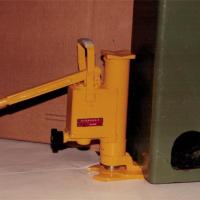 Un ancien cric (poignée en bakélite)